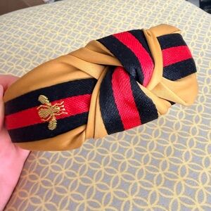 Elegant Tan and Black Headband with Red Stripe